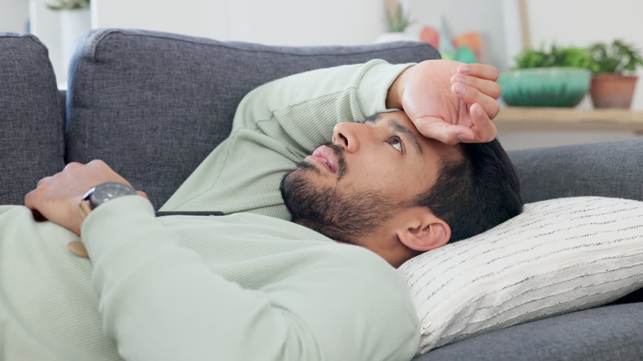 Upset, frustrated and sad young male lying