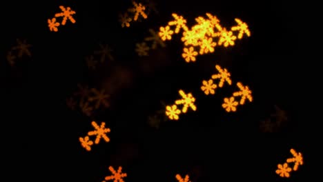 Beautiful-snowflake-shape-bokeh-from-flashing-LED-lights,-Christmas,-winter,-holiday-or-glamour-party-background-concept,-copyspace