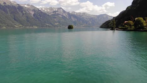 Two-Kayakers-on-a-Clear-Alpine-Lake-Surrounded-by-a-Large-Mountain-Range