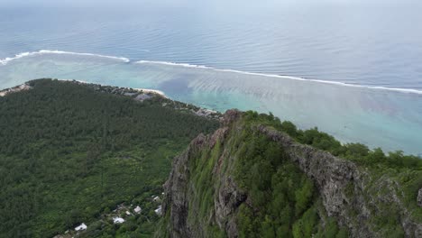 Aerial-view-of-rocky-mountain-above-the-ocean