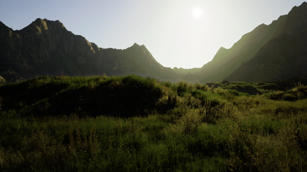Sunrise over rolling hills and majestic mountains in a tranquil landscape