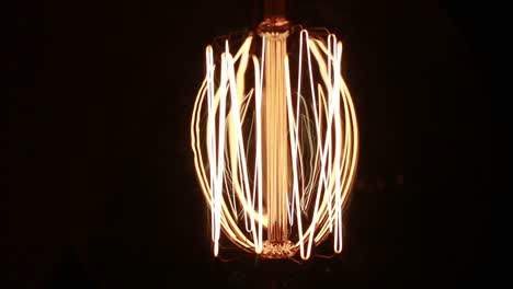 retro industrial incandescent light lamp tungsten filament blinks in the dark