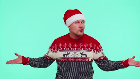 confused man in christmas sweater feeling embarrassed about ambiguous question having doubts no idea