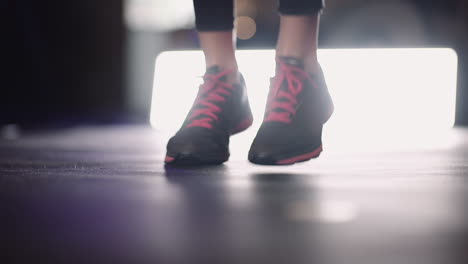 Confident-Young-Woman-Exercising-Using-Skipping-Rope-At-Gym