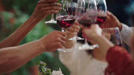 multiracial friends celebrating at dinner party making toast drinking wine enjoying happy reunion chatting sharing food having fun evening sitting at table outdoors 4k