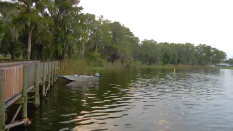 Boat-on-lake-as-clouds-fly-by-in-the-mornng-