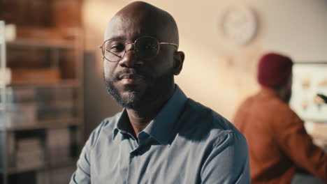 portrait of african american archaeologist at workplace in laboratory
