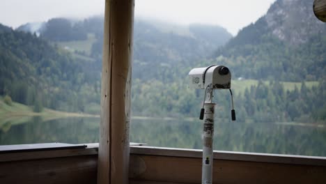 smooth dolly moving reveal monocular overlooking scenic mountain lake