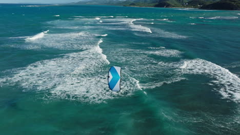 kiteboarding in turquoise ocean