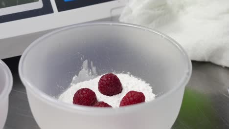 preparing raspberries for dessert