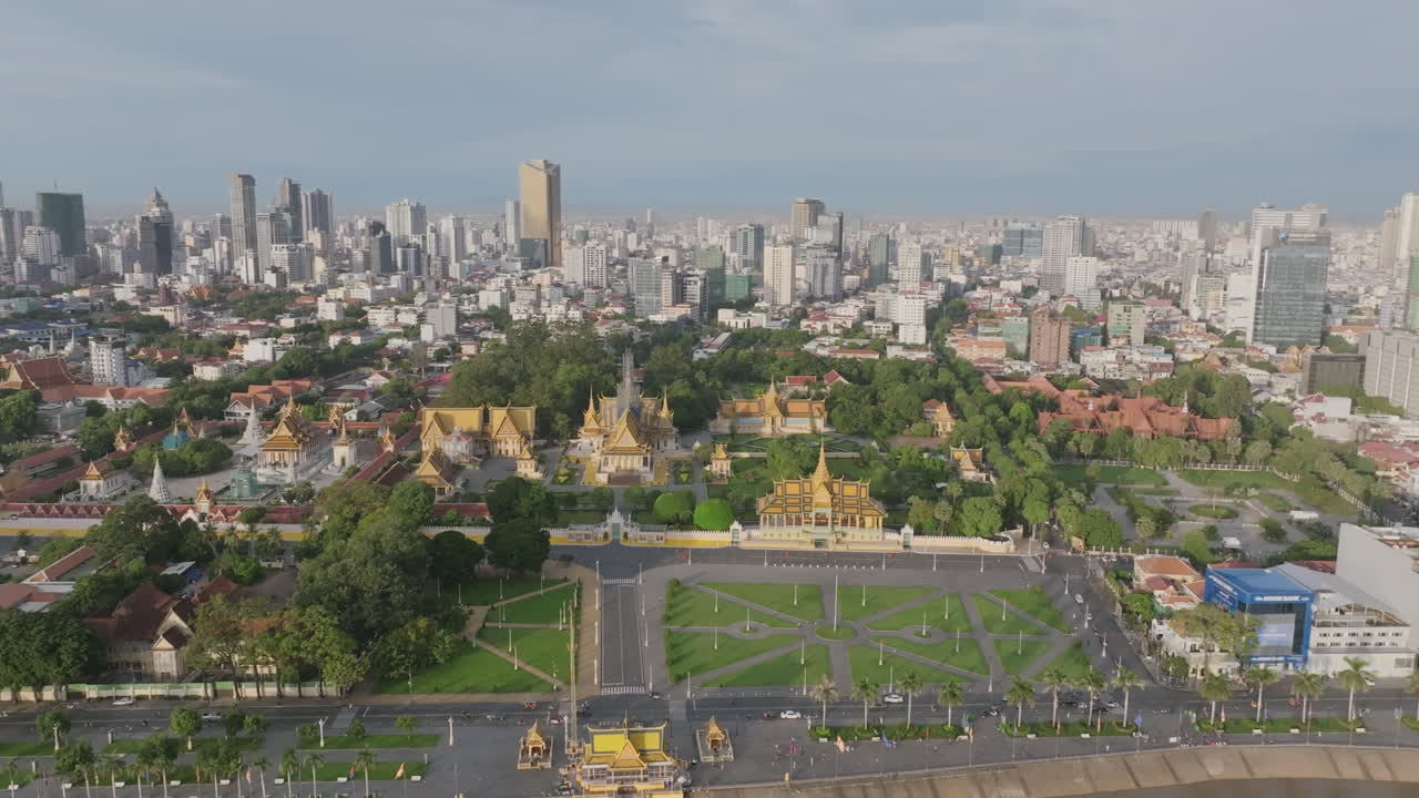 Aerial video of Phnom Penh shows the Royal Palace and surrounding greenery in full sunlight, with the city rising behind it