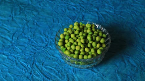 fresh green peas placed in a bowl