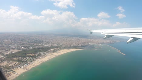 catania aerial view of the city coast from above on airplane