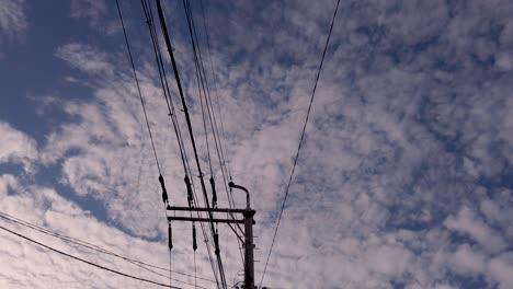 telegraph pole and electricity cables on a cloudy day