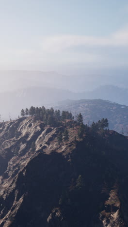 aerial view of a mountain range with fog