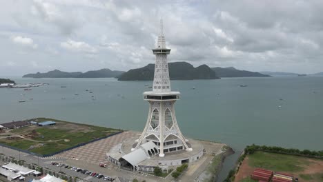 Aerial-orbits-Maha-Tower-on-Malaysia-tourist-city-of-Kuah,-Langkawi