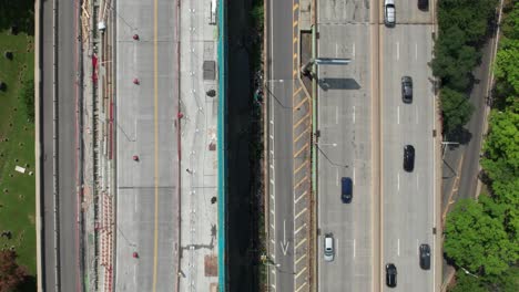 Aerial-view-of-smooth-traffic-flow-on-side-by-side-highways