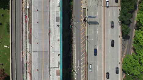 aerial view of smooth traffic flow on side-by-side highways