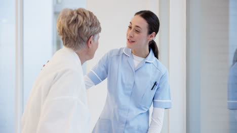 Hospital,-talking-and-senior-woman-with-nurse