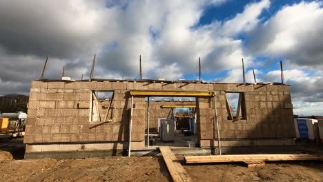 Timelapse-of-a-still-hempcrete-construction-site-with-moving-clouds