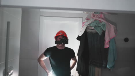 first-person perspective of a man with a camera-mounted construction helmet, reflecting on bathroom tasks in a mirror