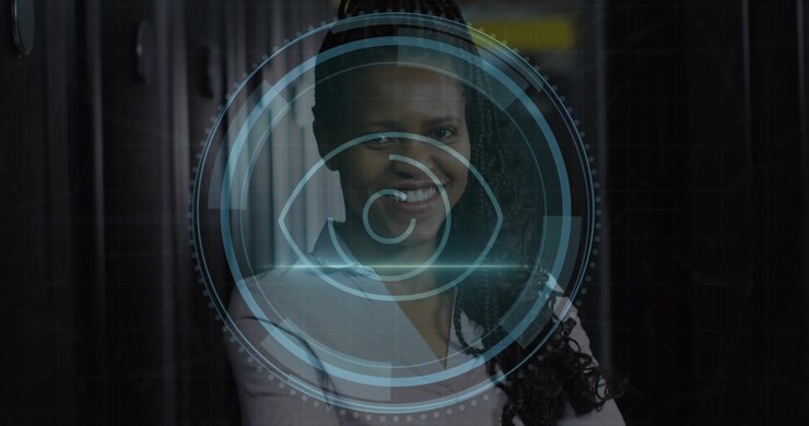 Animation of eye retina scanner over african american female engineer smiling at server room