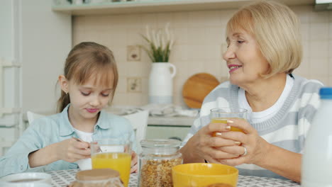 grandmother and granddaughter enjoying breakfast