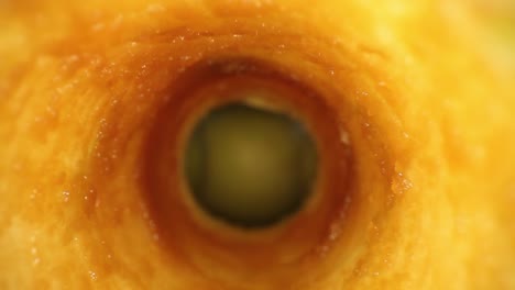 Starting-inside-the-interior-of-an-oxidized-apple-core,-pulling-out-of-the-apple-away-from-a-glimpse-of-3-other-apples-in-the-center