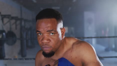 video of fit african american man boxing at gym