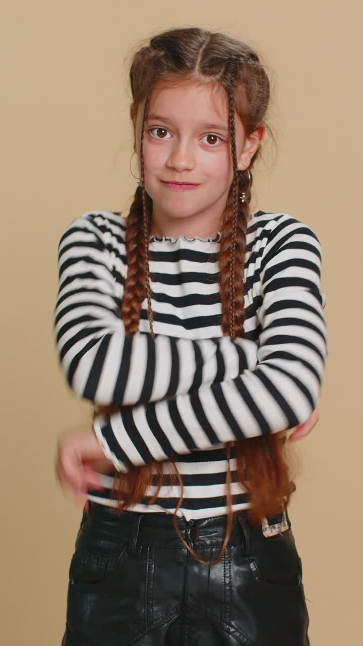 Angry aggressive preteen child girl kid showing fig negative gesture refusal sign dont want to share