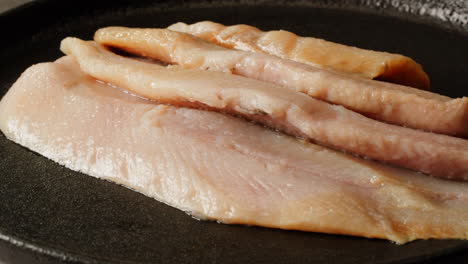 smoked fish fillets in a pan