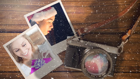 video composition with snow over camera with instant pictures on side