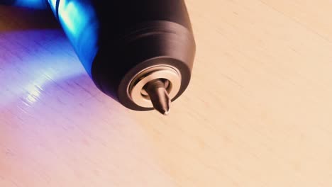 close up to a battery screwdriver rotating bit, workshop light [hd1920 x 1080] fps 29.97