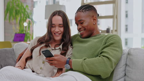 phone, happy and couple relaxing on a sofa