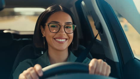 happy young woman driving a car