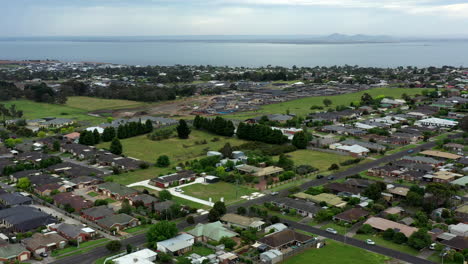 AERIAL-Costal-Town-Of-Drysdale,-Australia-With-You-Yang-Mountain-Ranges