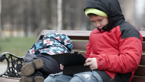 adorable young boy watching his brother