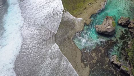 aerial dolly over magpupungko rock pools at high tide at siargao, the philippines