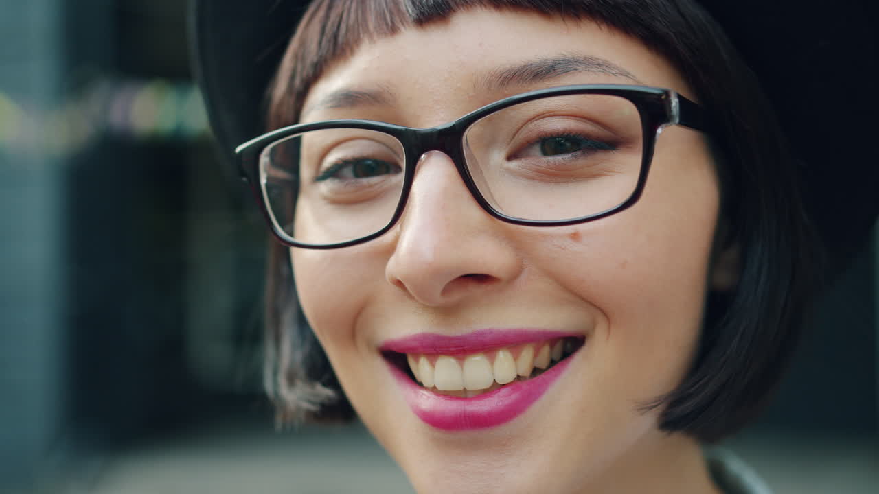 Smiling Woman with Glasses and Hat