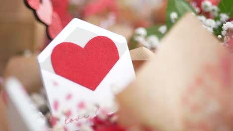 heart-shaped envelope in a floral arrangement