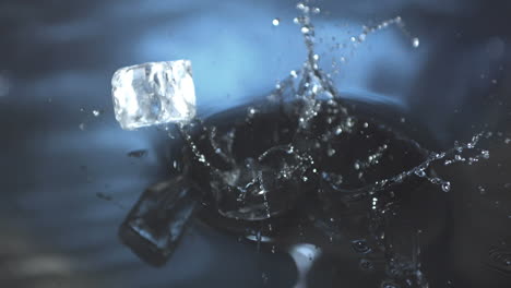 Ice-cubes-falling-in-water-