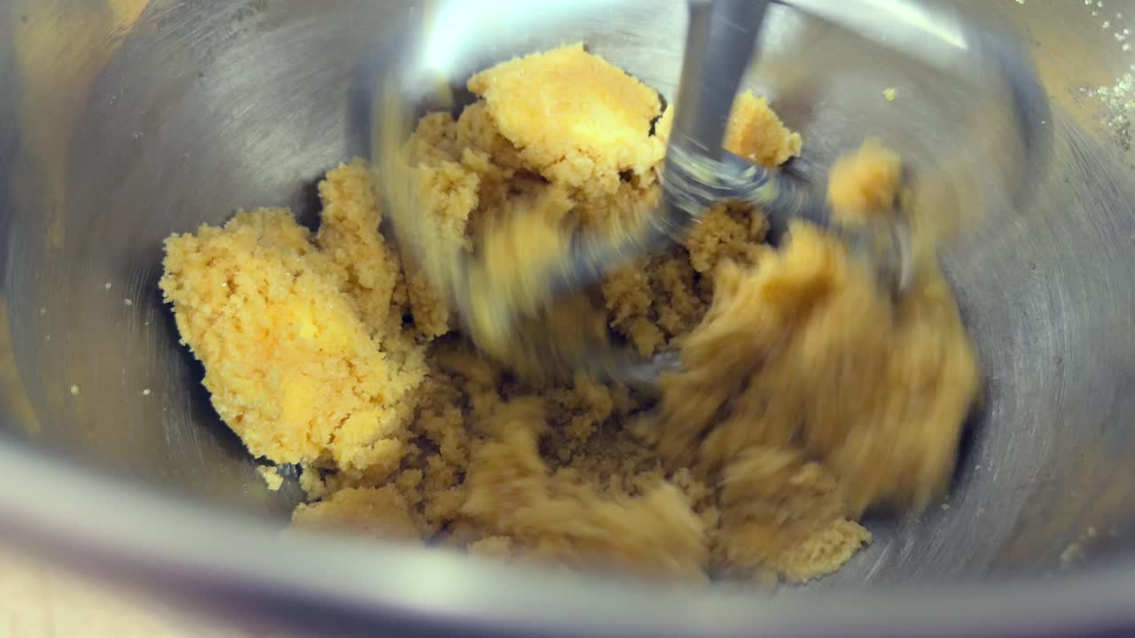 Creaming butter and brown sugar for oat and raising cookies with mixer, Mahe, Seychelles 25fps