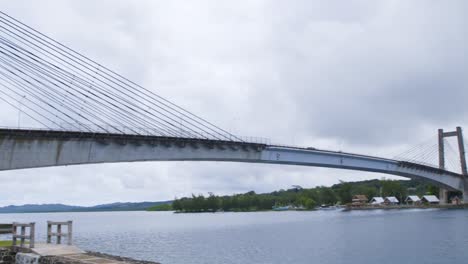 the friendship bridge in palau at mid-day, cloudy, slow motion