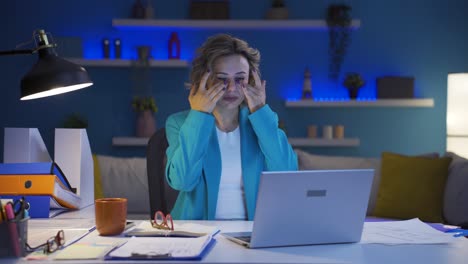 home office worker woman has eye pain.