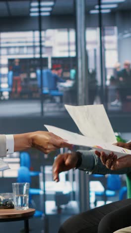 vertical video diverse company leaders discuss business development with performance data