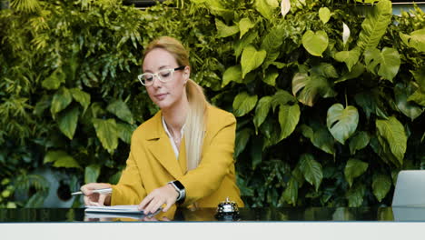 Blonde-receptionist-working-in-a-hotel