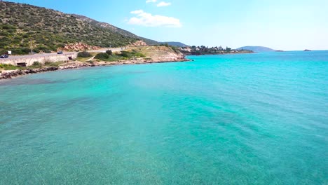 Beautiful-sea-resort-on-the-Agean-coast-of-Greece-with-Aqua-colored-waters-from-drone-view