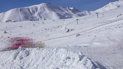 snowplow moving and shaping the snow on a