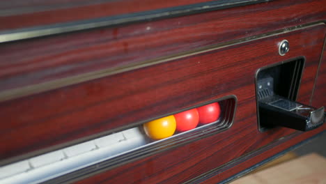 pool balls entering a coin oporated pool table return rack system