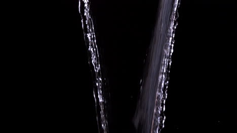 water pouring against black background